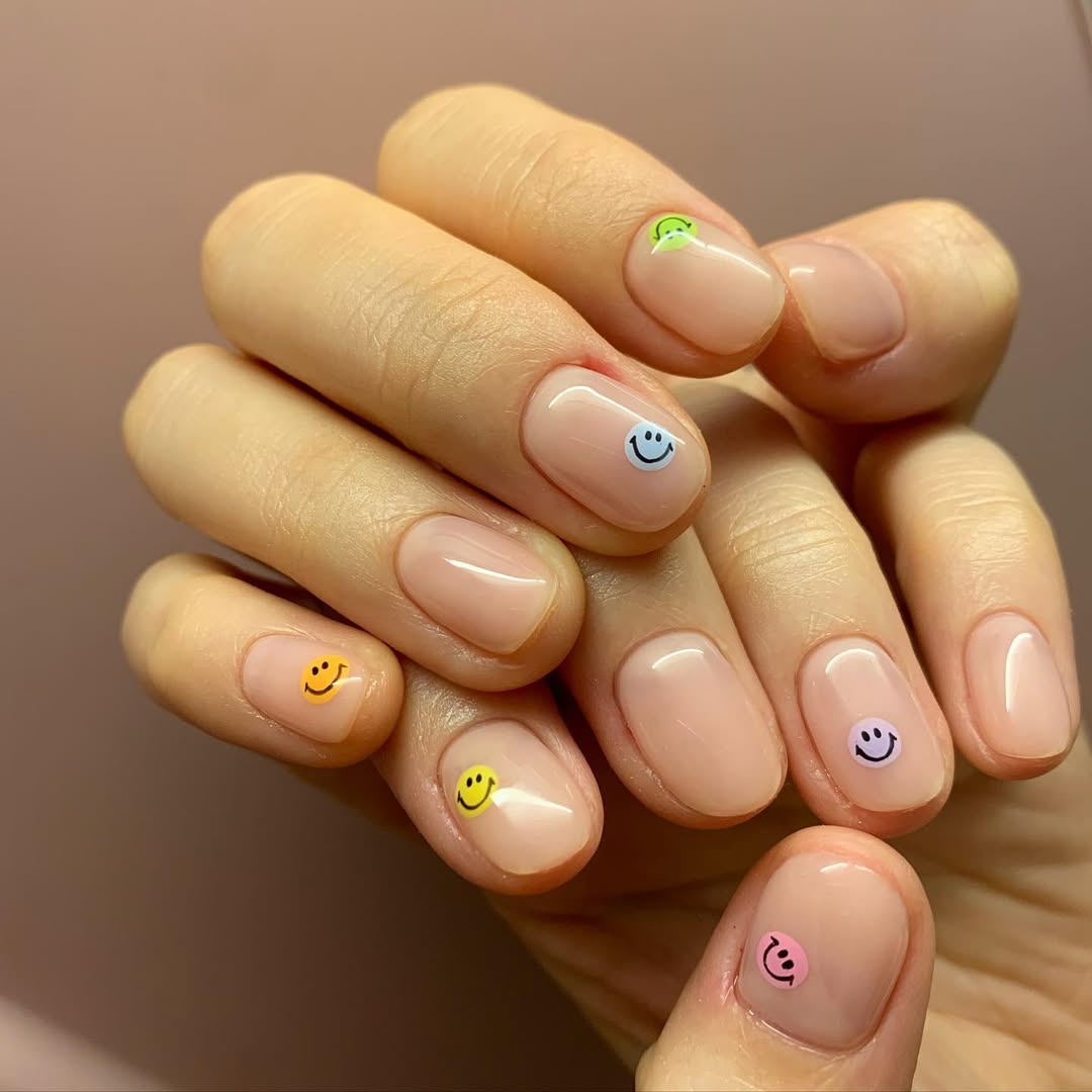 Playful Smiley Face Nude Glossy Short Oval Nails