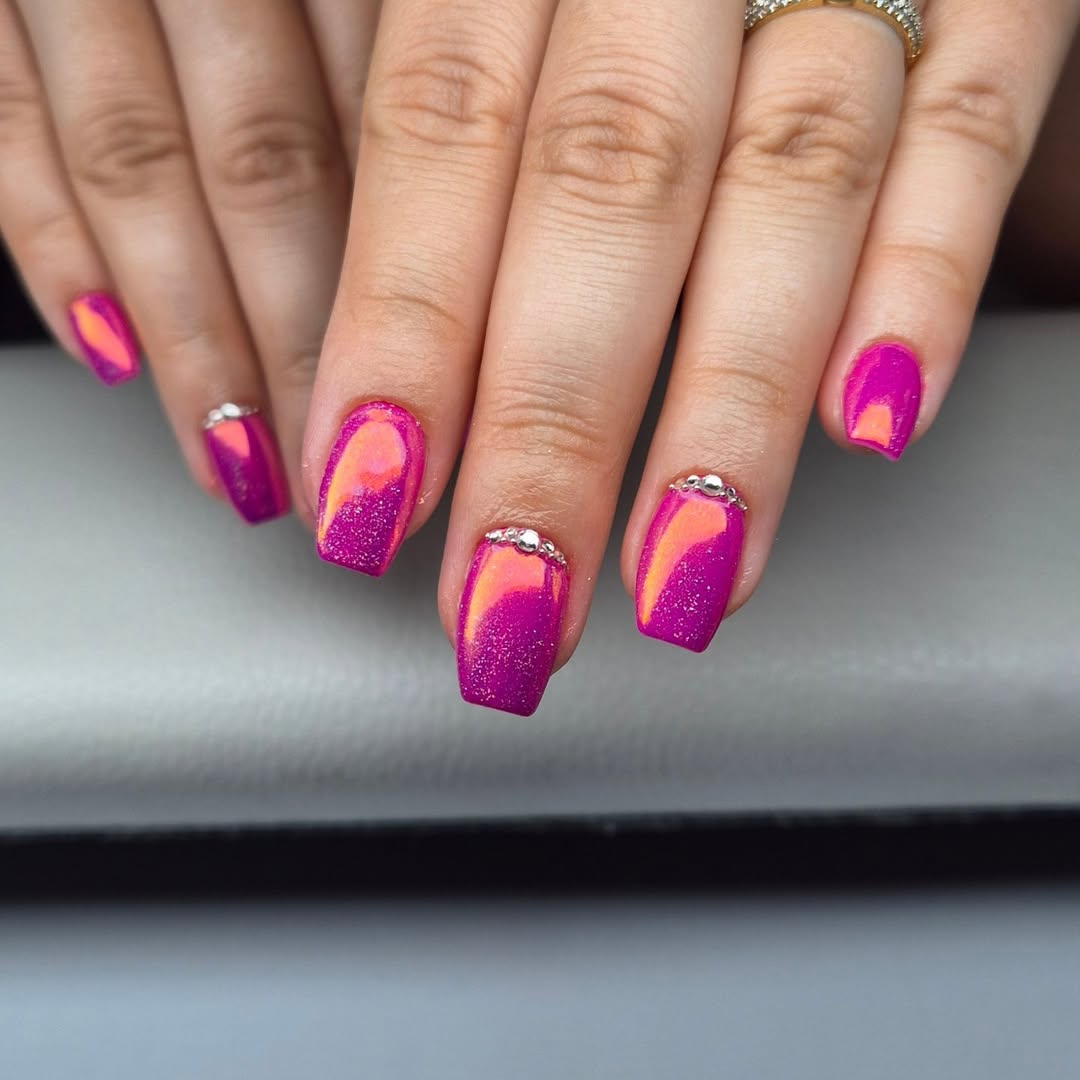 Radiant Magenta Orange Cat Eye Nails with Glitter Accents