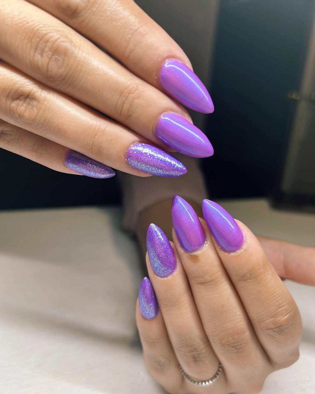 Shimmering Purple and Holographic Stiletto Nails