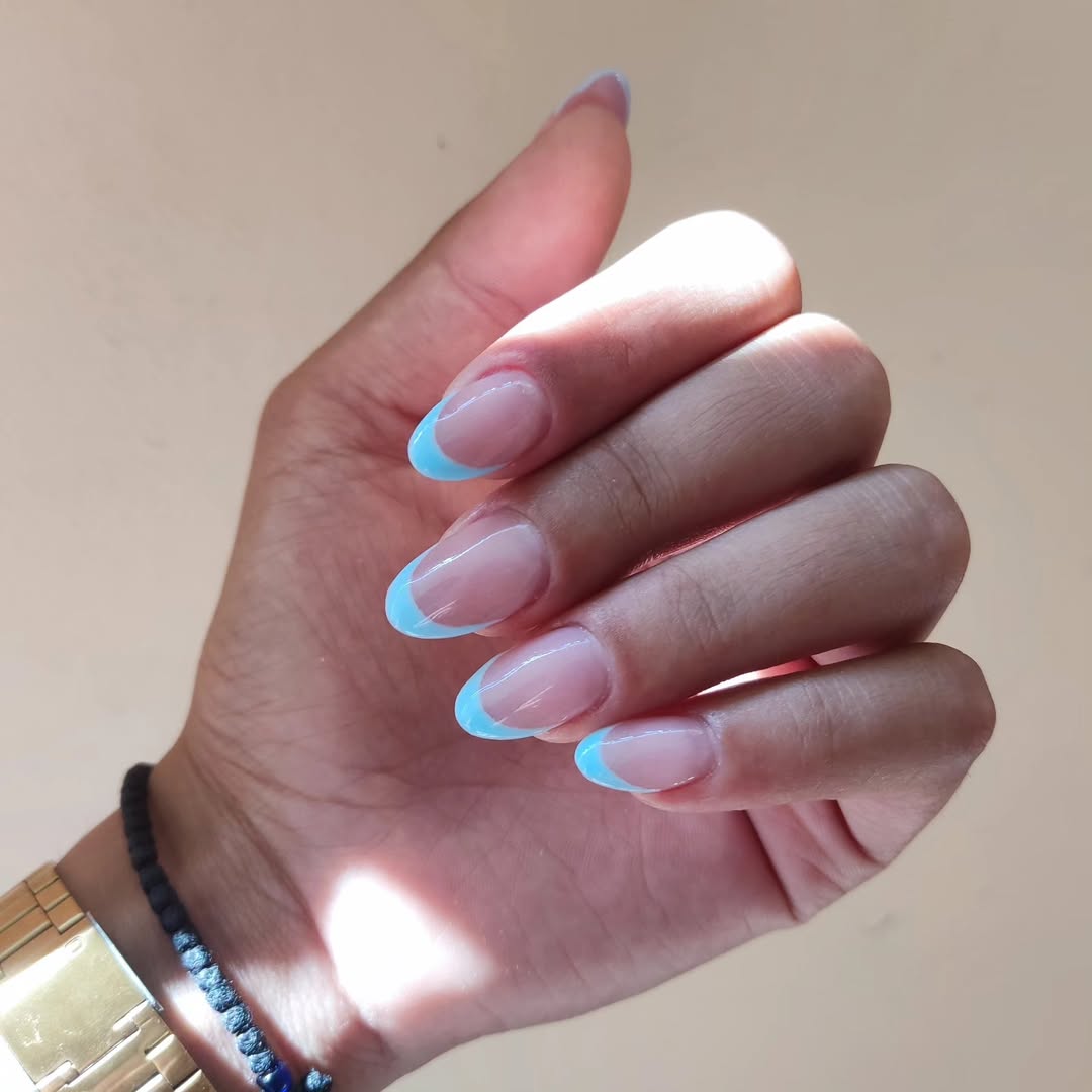 Sky Blue Glossy French Tip Oval Nails