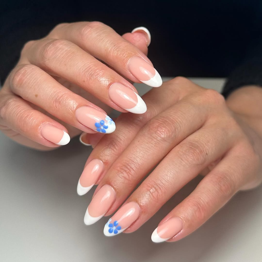 Soft Pink French Tips with Blue Floral Accents