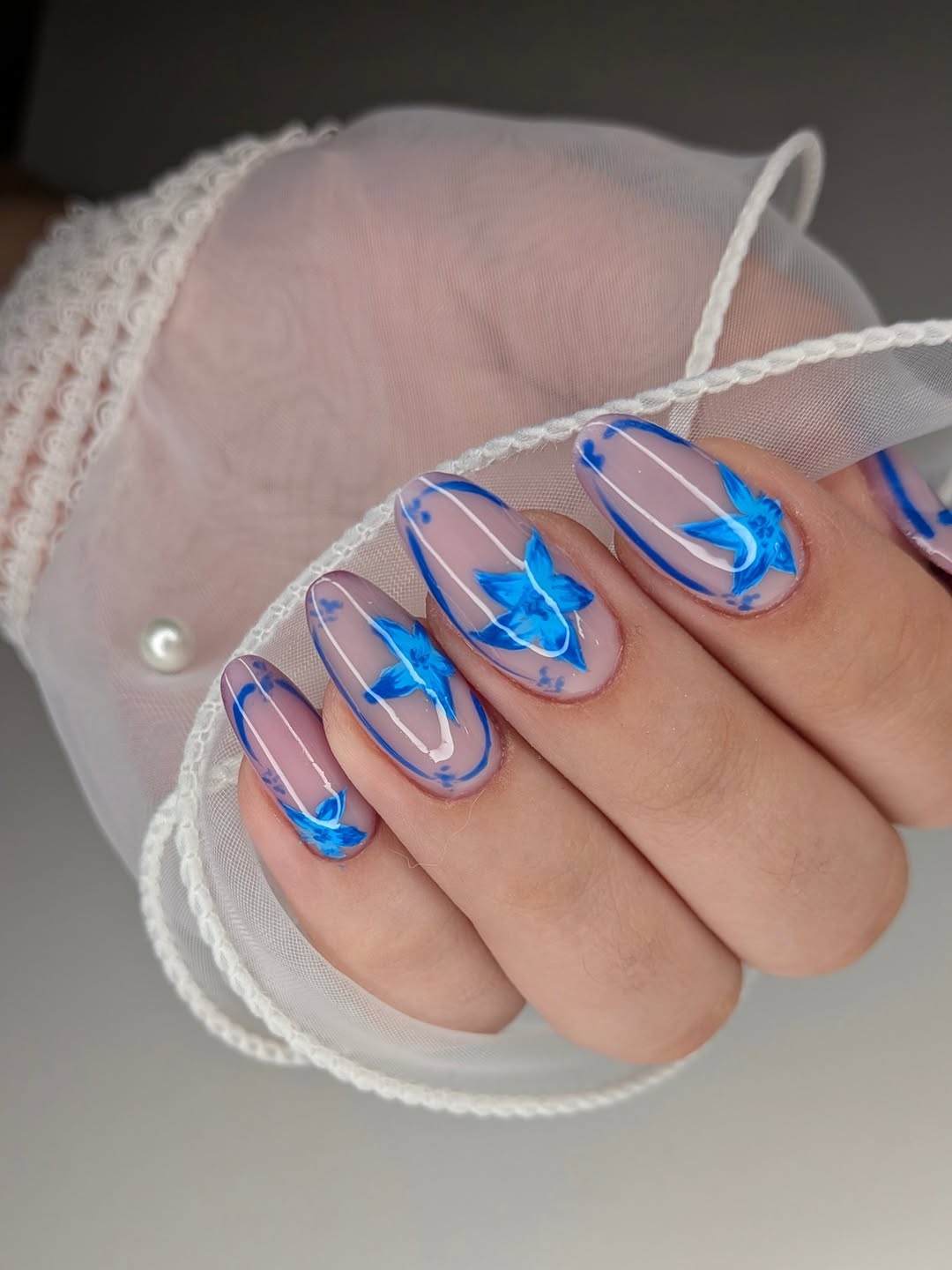 Summer Blue Floral Swirl On Glossy Oval Nails