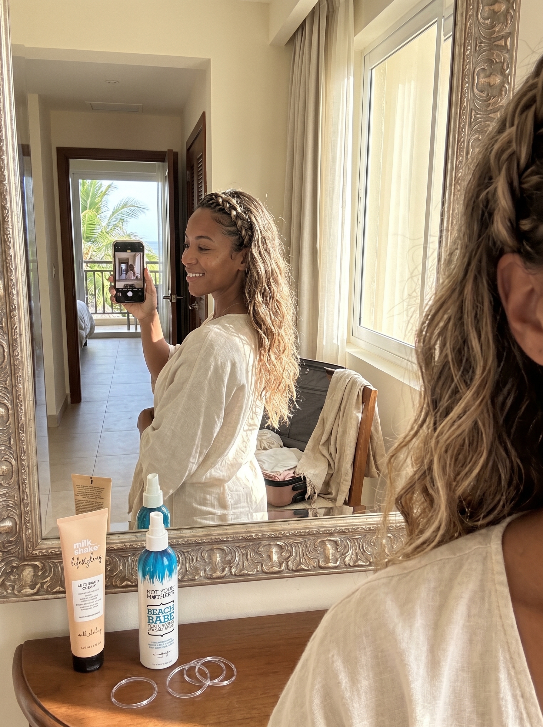 An effortless braided headband tuck style with mushroom blonde and natural tones, ideal for everyday wear or a beach resort vacation. Styled with sea salt spray for waves.