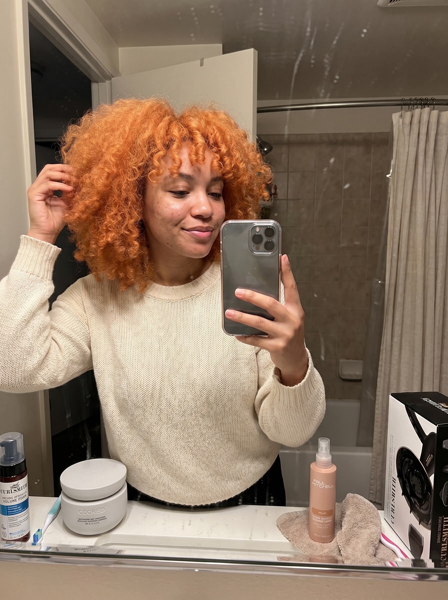 Voluminous Cloud Curls with Apricot Crush Micro-Bangs, a playful boho look for summer curly hairstyles 2026 and festivals.