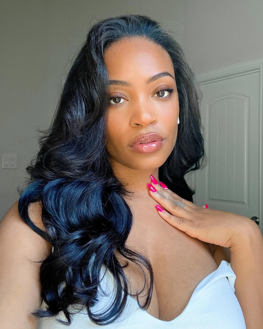 Beautiful black woman wearing a chic updo with braided accents, perfect for elegant summer hairstyles for black women 2026.