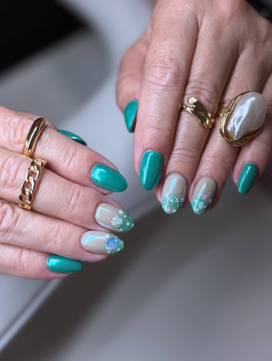 Summer Tidal Teal Sea-Inspired Almond Nails with Shell Art