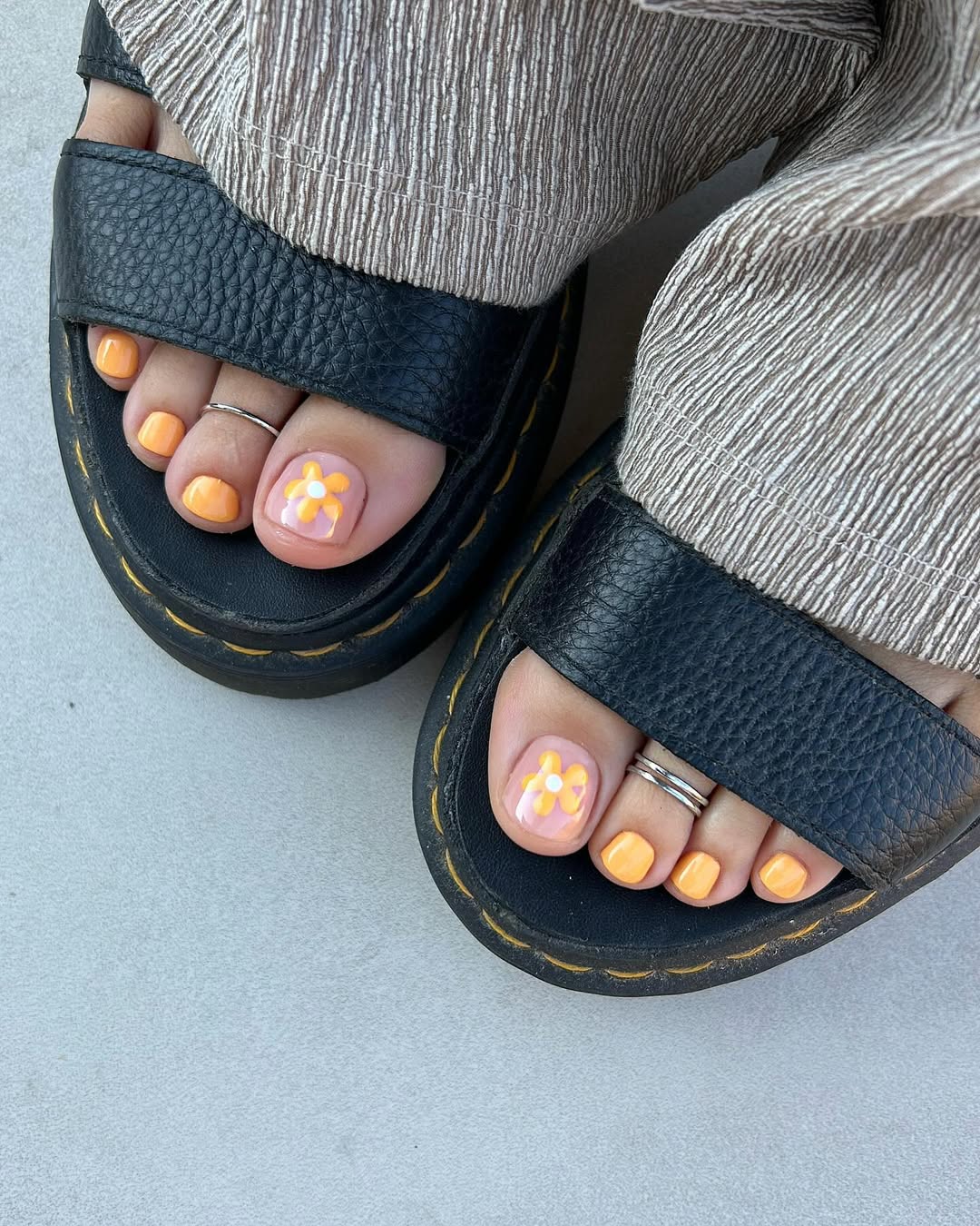 Sunny Orange Pedicure with Daisy Accent