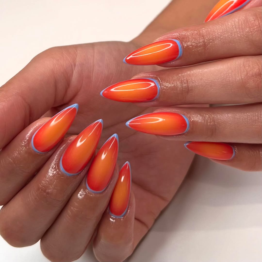 Sunset Orange Ombré Stiletto Nails with Blue Outline