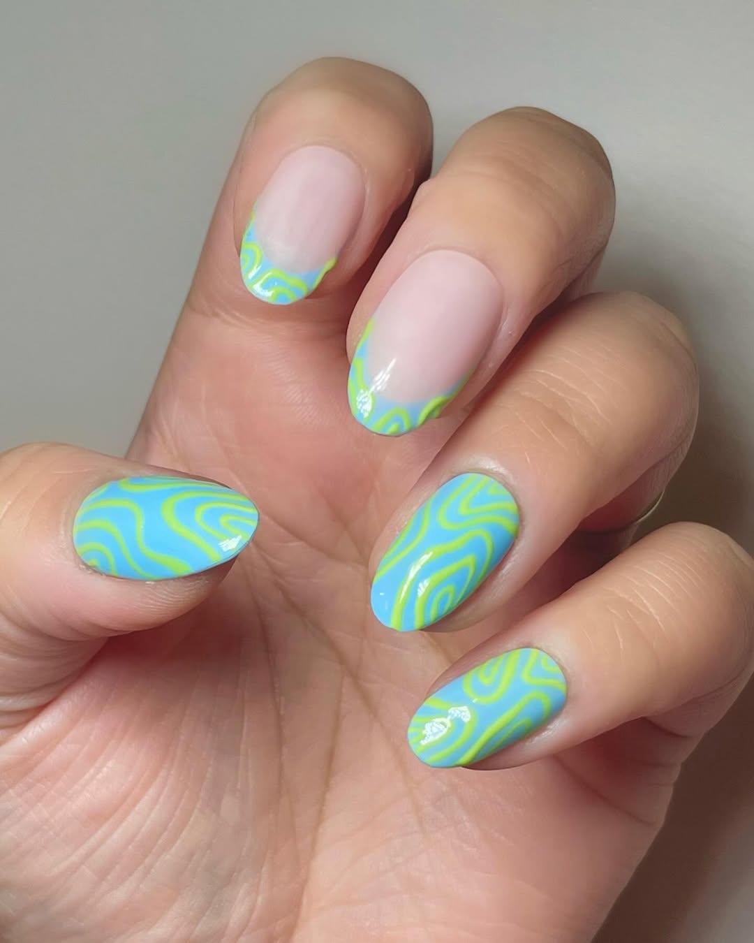 Swirl Design Bright Blue And Neon Green Oval Nails