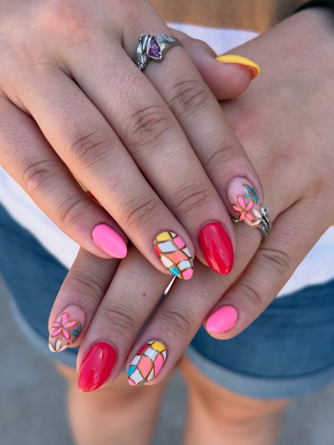 Vibrant Abstract Almond Nails with Floral Accents