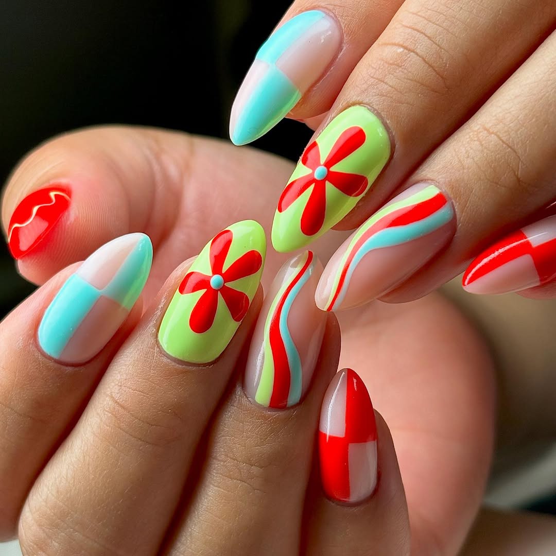 Vibrant Abstract Almond Nails with Red Flowers