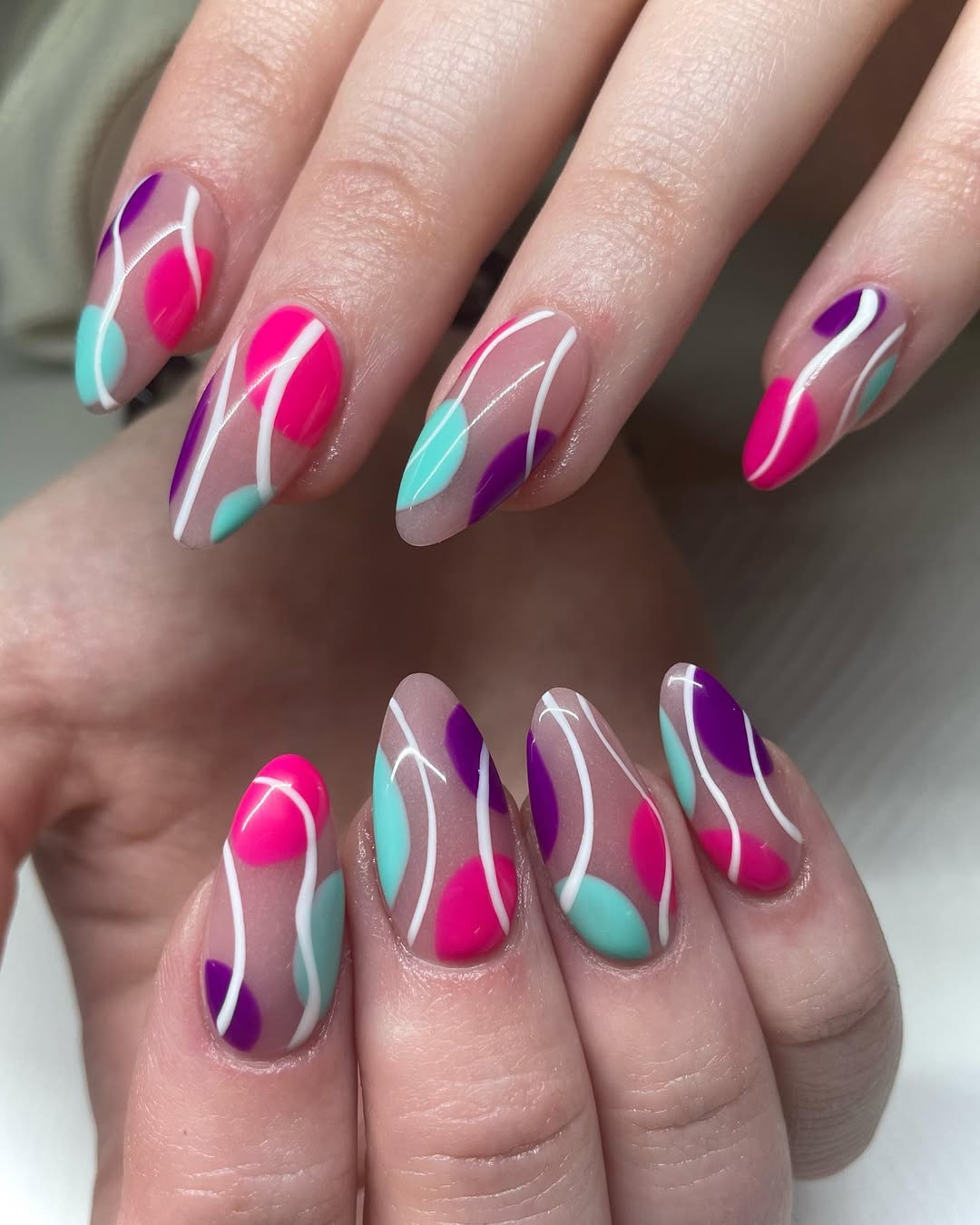 Vibrant Abstract Swirl Glossy Almond Nails