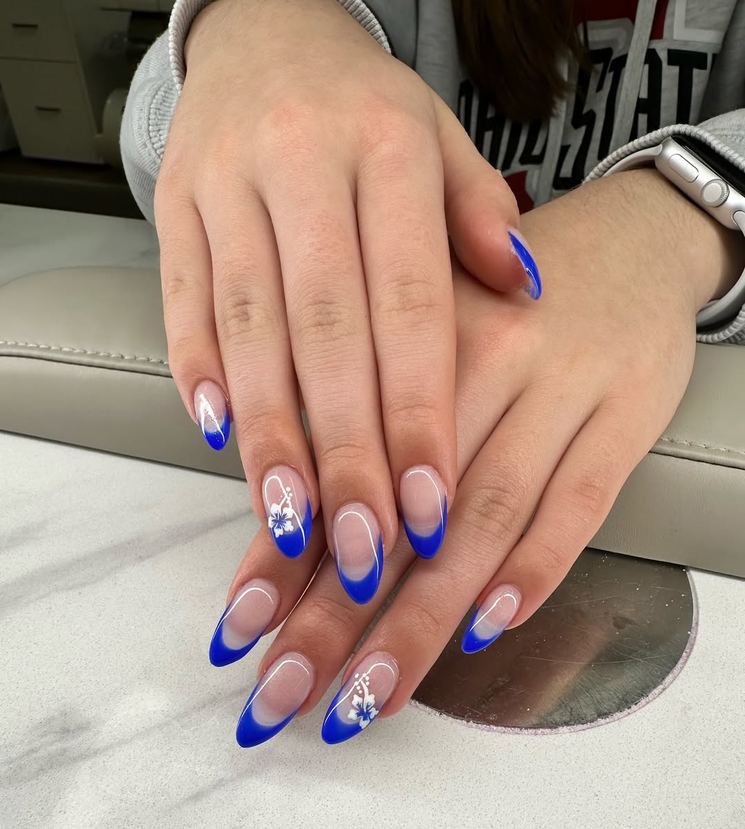 Vibrant Blue Ombré French Tips with Hibiscus Art