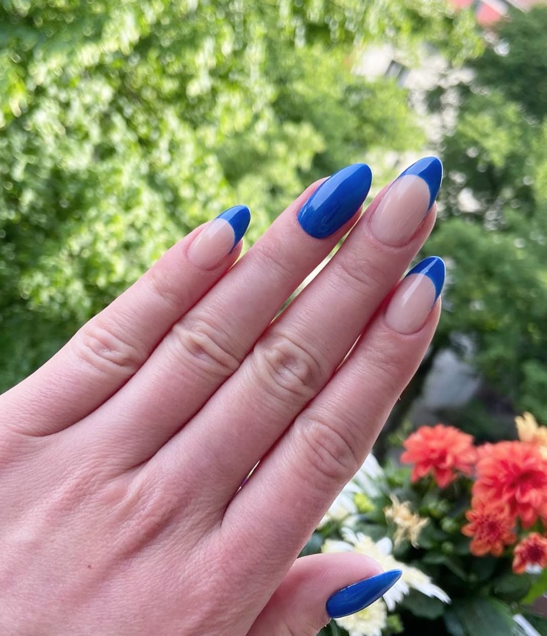Vibrant Blue Reverse French Almond Nails