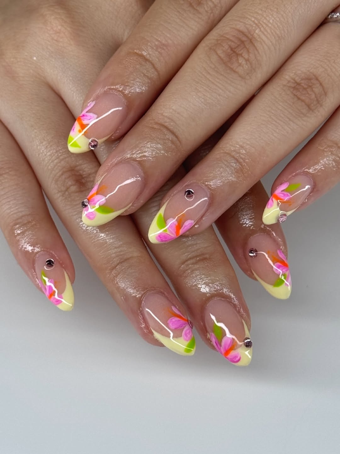 Vibrant Floral French Tips With Rhinestone Accents