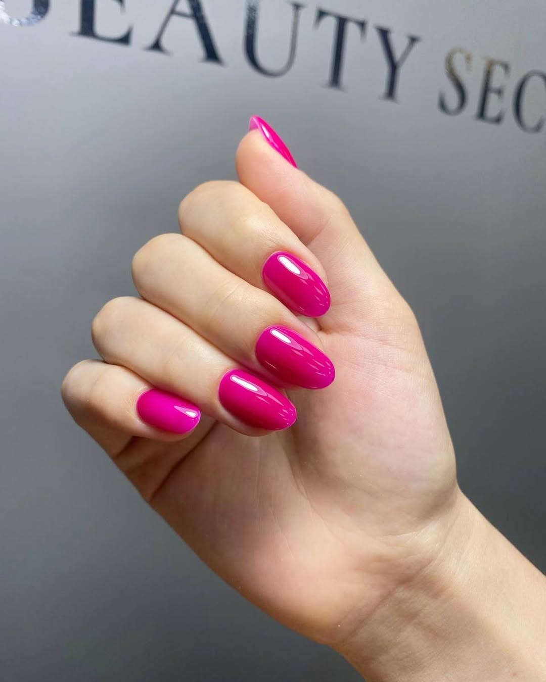 Vibrant Fuchsia Glossy Oval Summer Nails