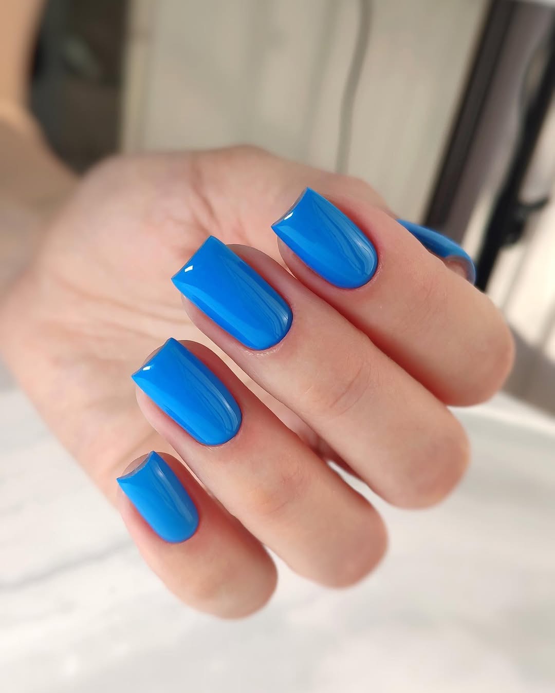 Vibrant Glossy Blue Lagoon Short Square Nails