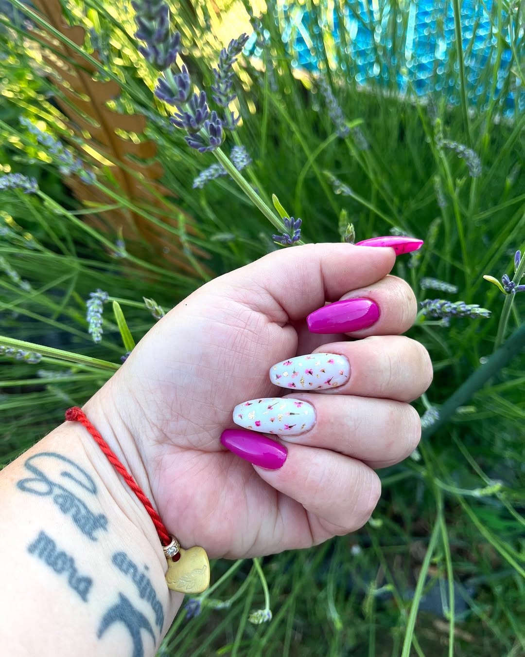 Vibrant Magenta and Floral Oval Nails