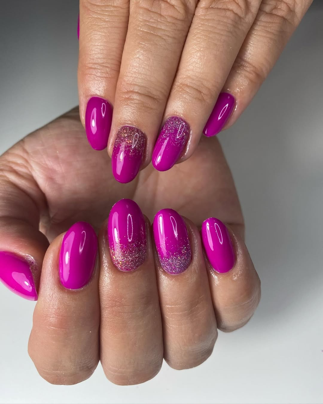 Vibrant Magenta Glitter Ombre Oval Nails