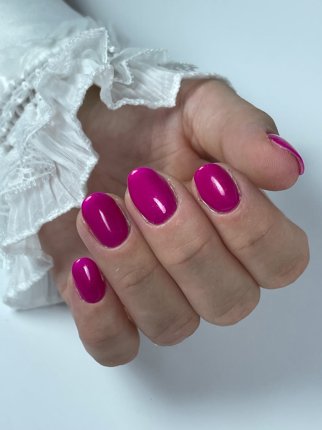 Vibrant Magenta Glossy Oval Manicure