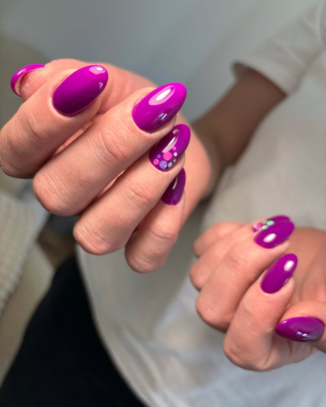 Vibrant Magenta Oval Nails with Playful Polka Dots