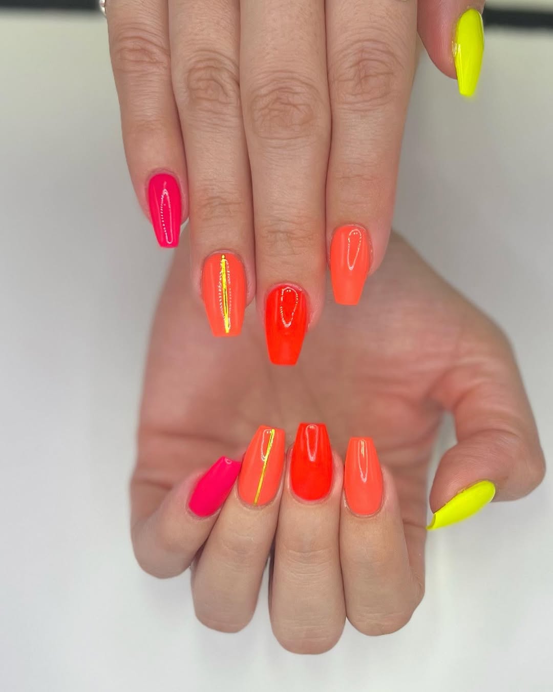 Vibrant Mixed Neon Coffin Nails with Gold Accents
