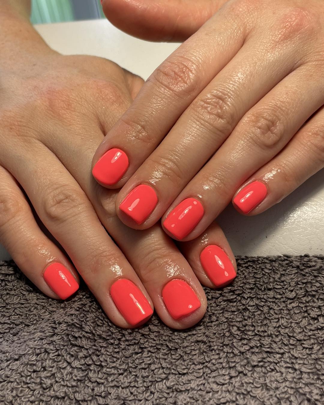 Vibrant Neon Coral Glossy Short Round Nails