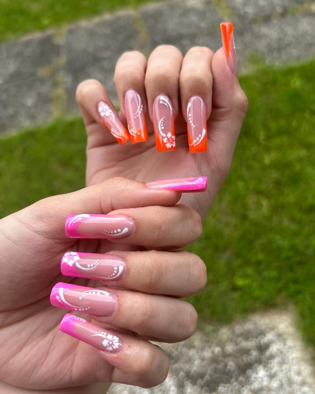 Vibrant Neon French Tips with White Floral Art