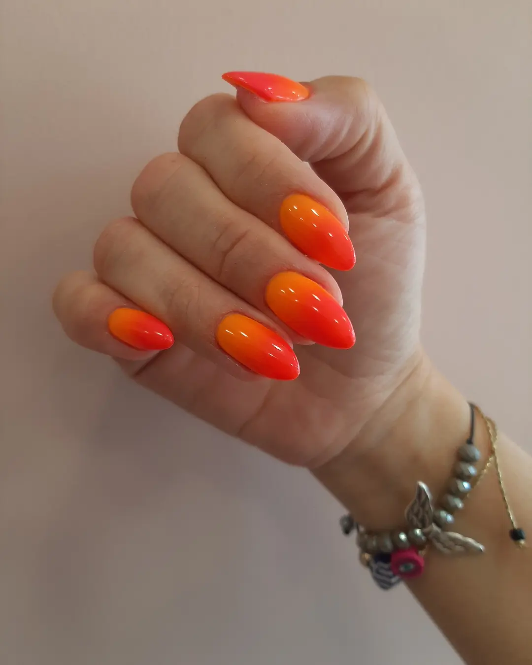 Vibrant Orange and Red Glossy Ombre Almond Nails