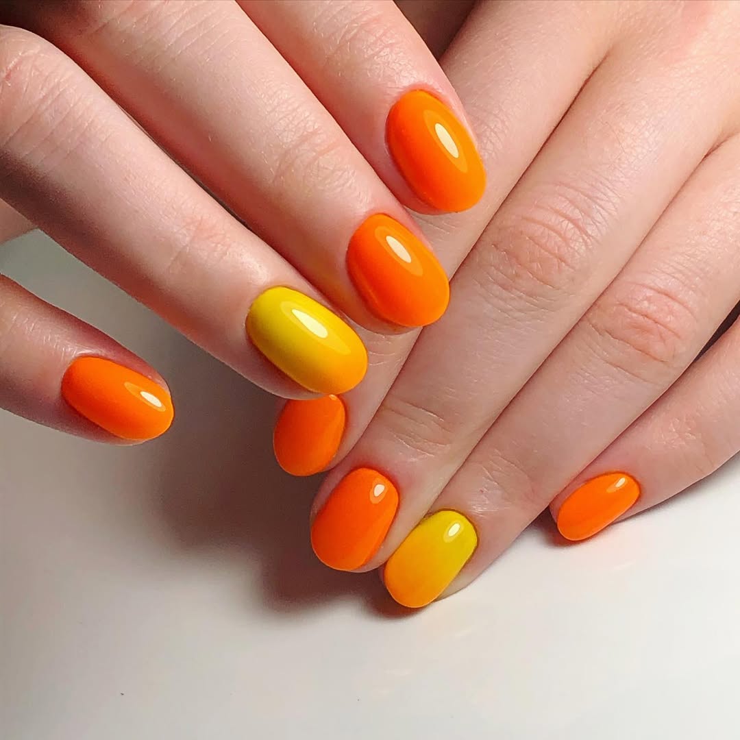 Vibrant Orange and Yellow Short Oval Nails