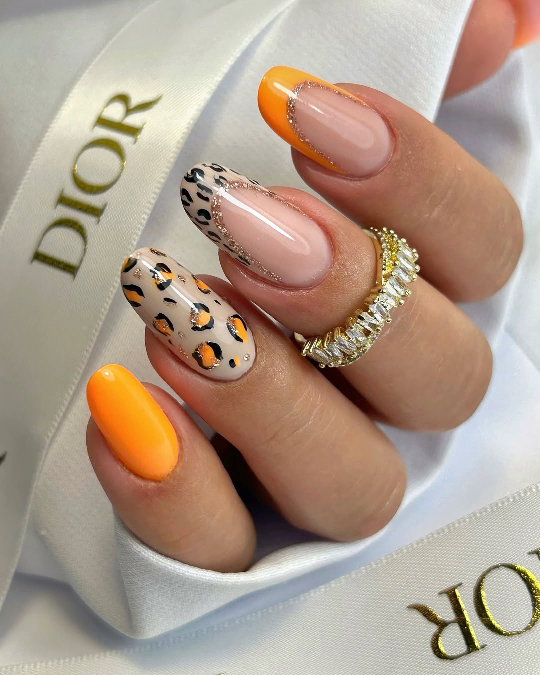 Vibrant Orange French Tips with Leopard Print Accent Nails