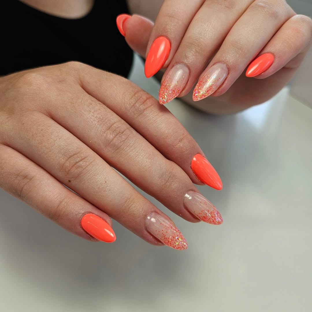 Vibrant Orange Glitter Fade Stiletto Nails