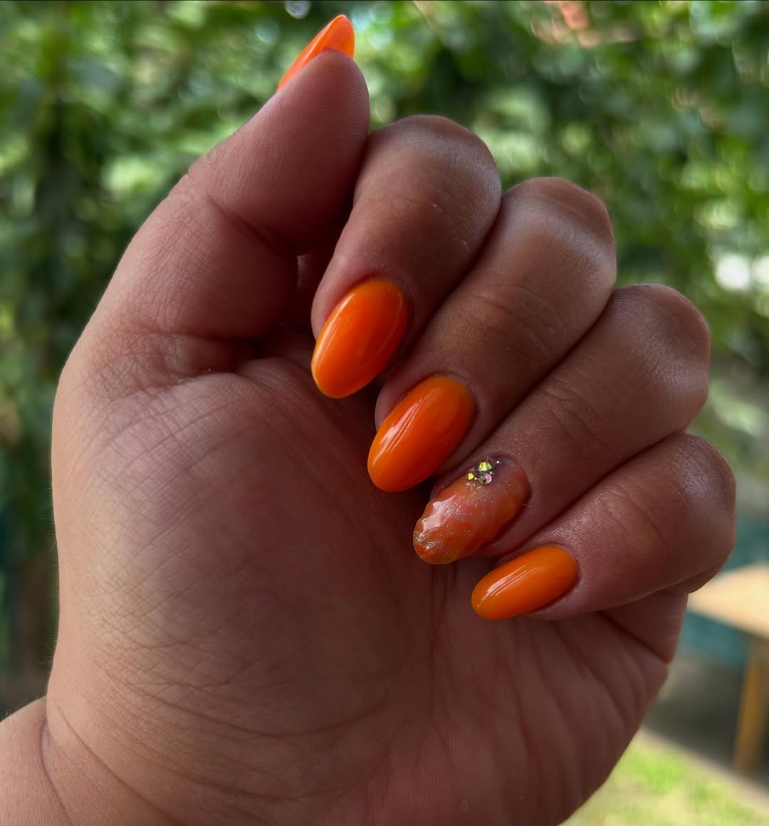 Vibrant Orange Jelly with Iridescent Pearl Accent Nails