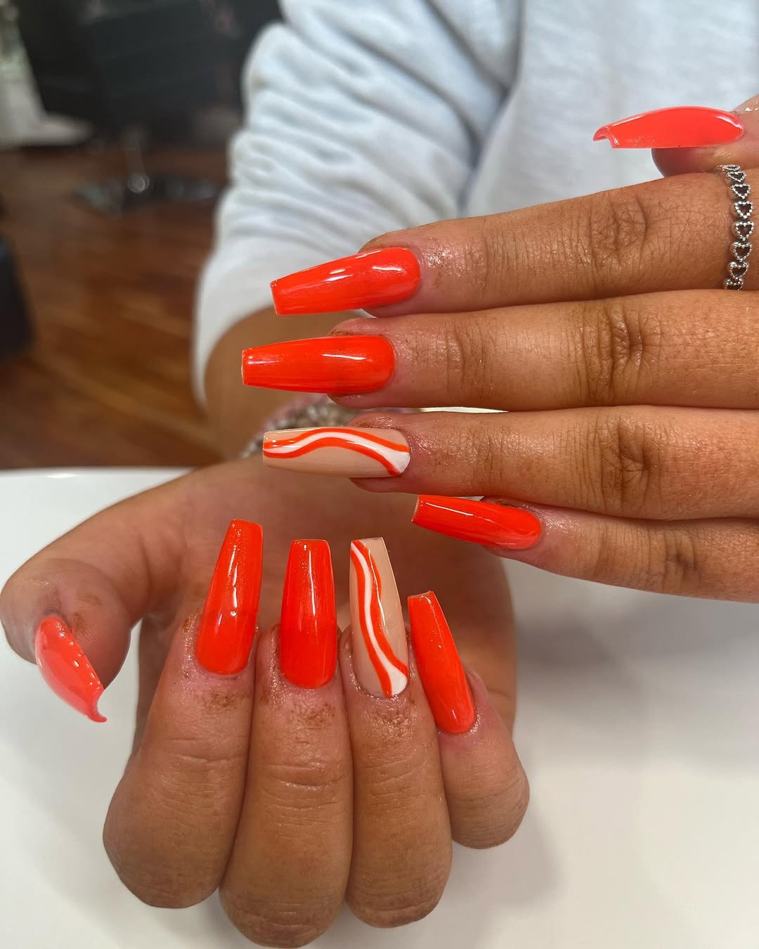 Vibrant Orange Swirl Coffin Nails