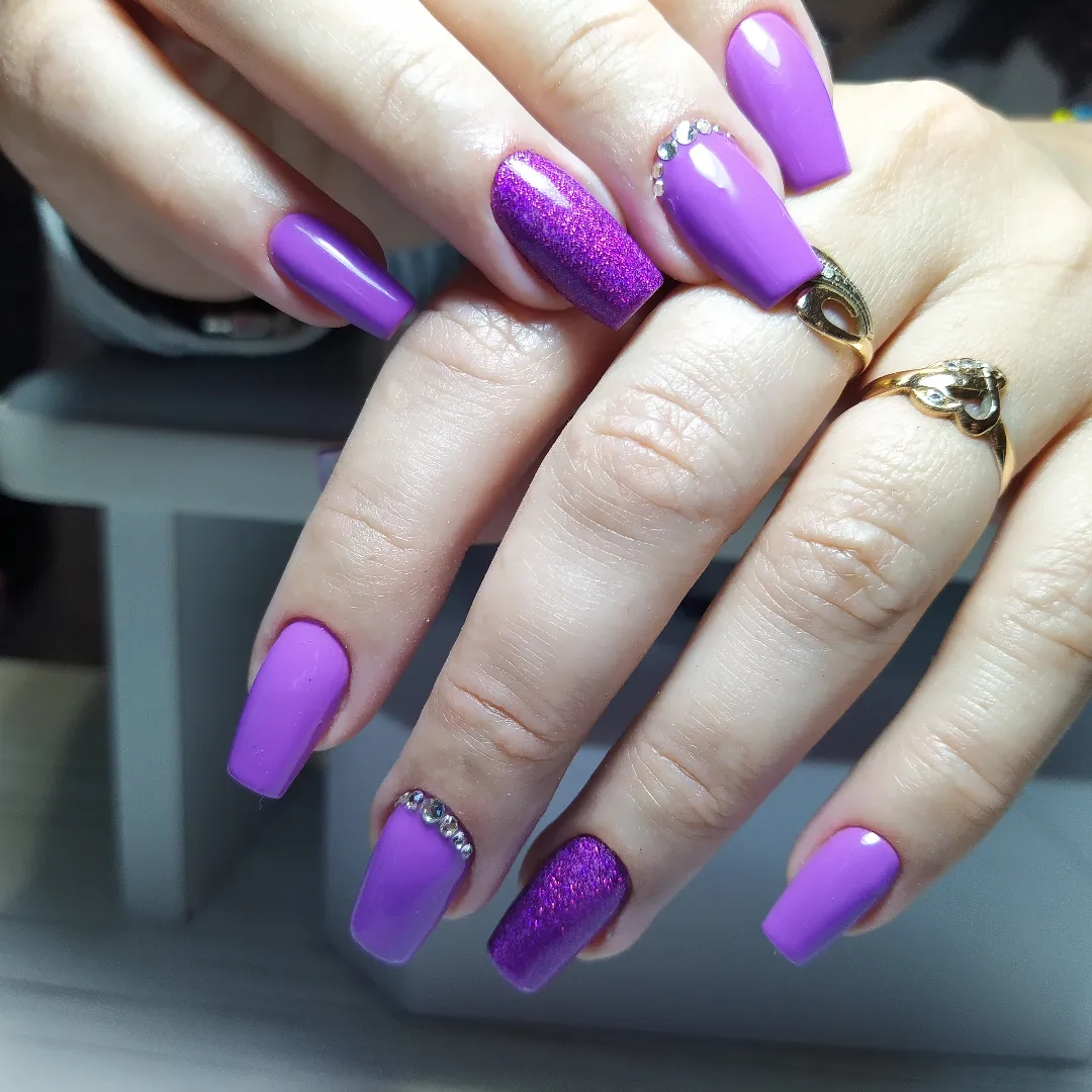 Vibrant Purple Glitter Adorned Long Coffin Nails