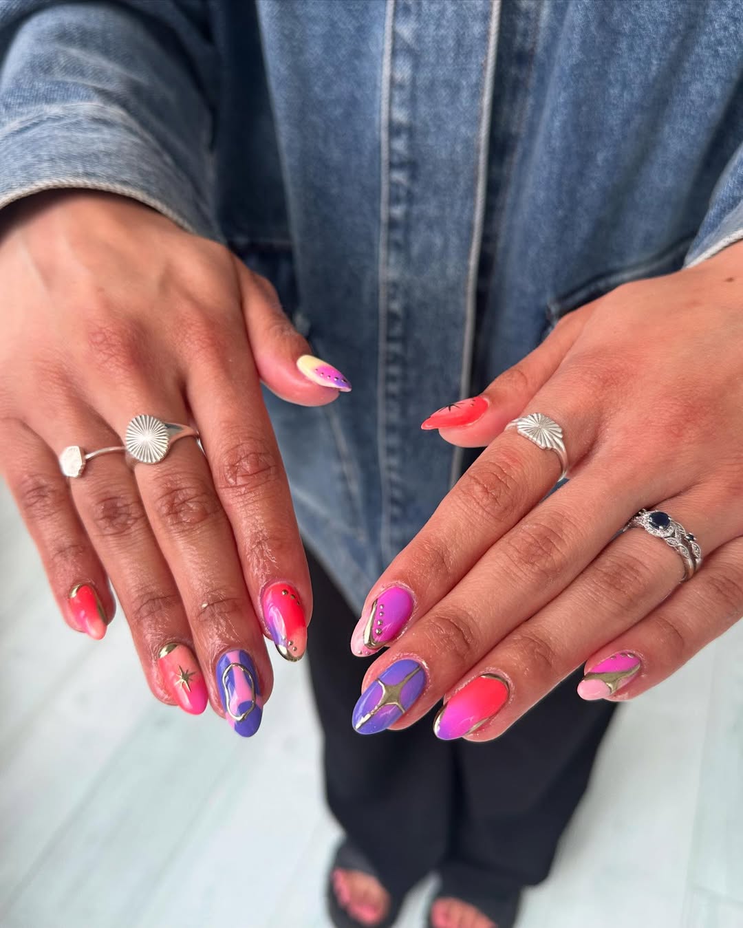 Vibrant Rainbow Abstract Gold Accents Almond Nails