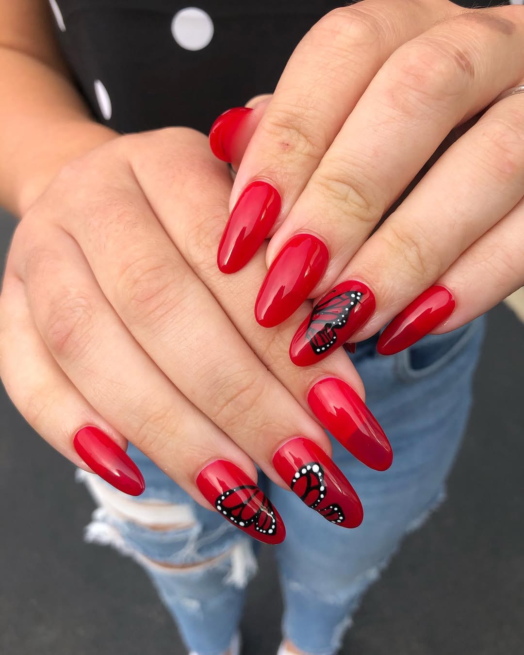 Vibrant Red Coffin Nails With Black Butterfly Art