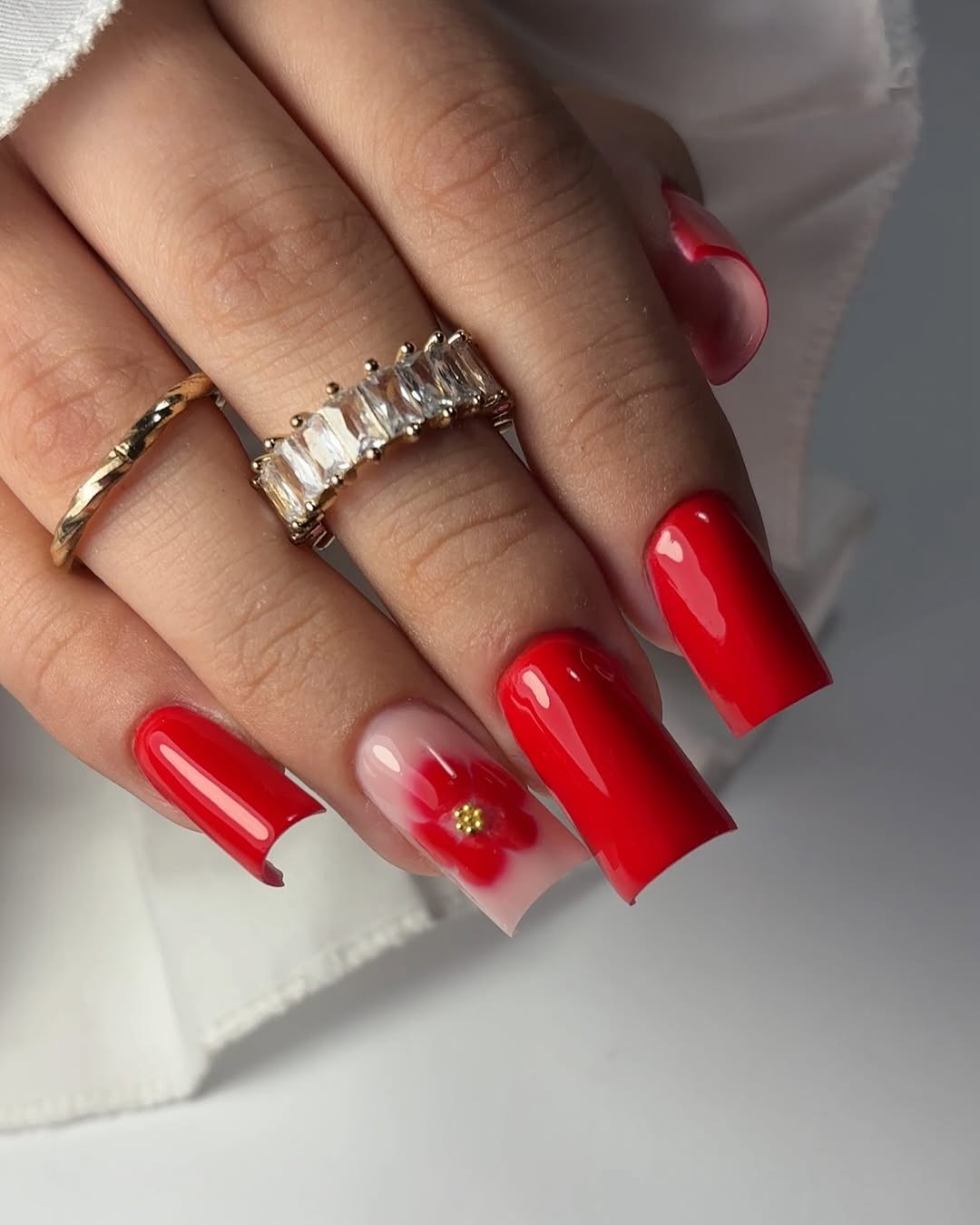 Vibrant Red Square Nails with Red Floral Accent