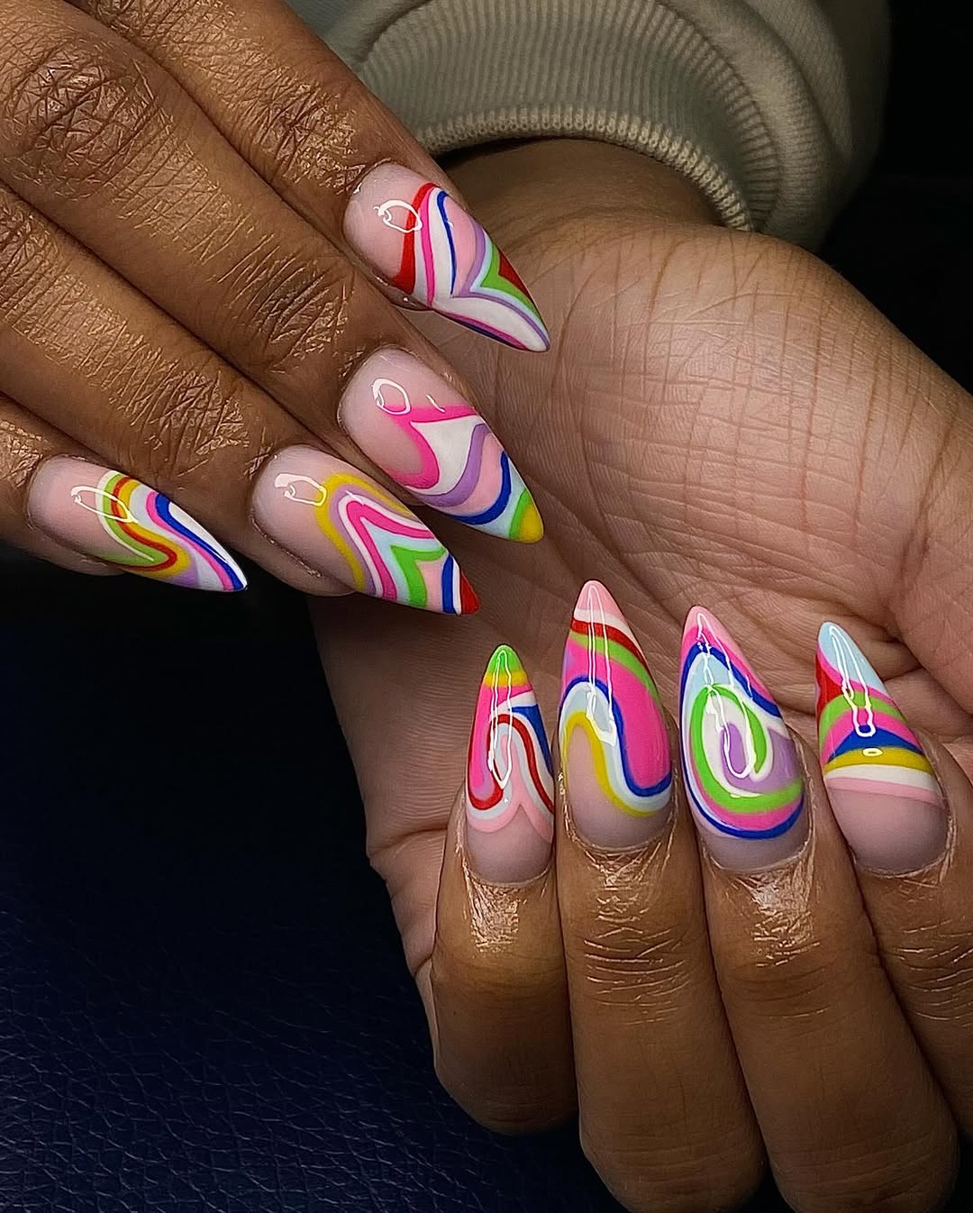 Vibrant Swirled Rainbow Stiletto Nails