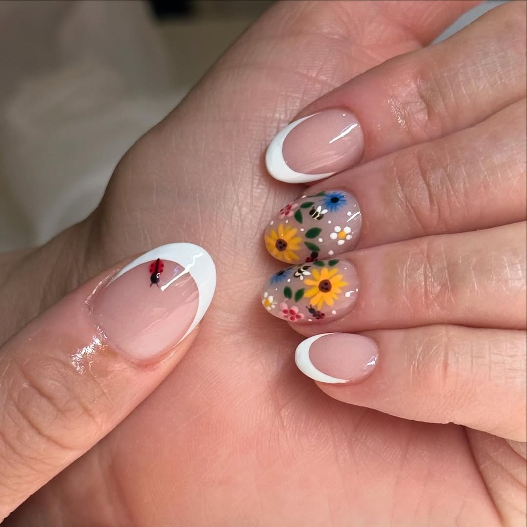 Whimsical Floral French Tips with Ladybug Accent