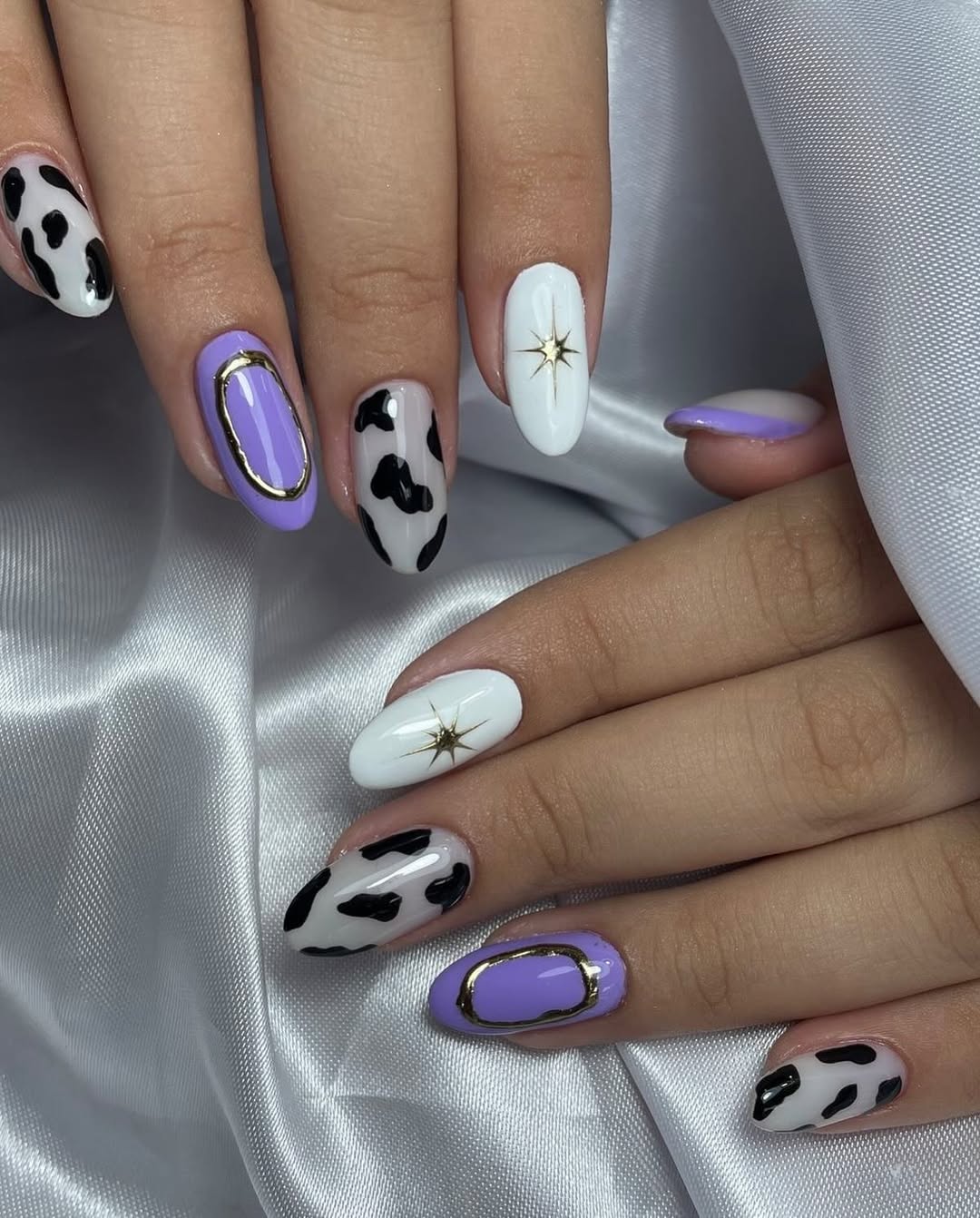 Whimsical Lilac Cow Print and Star Almond Nails