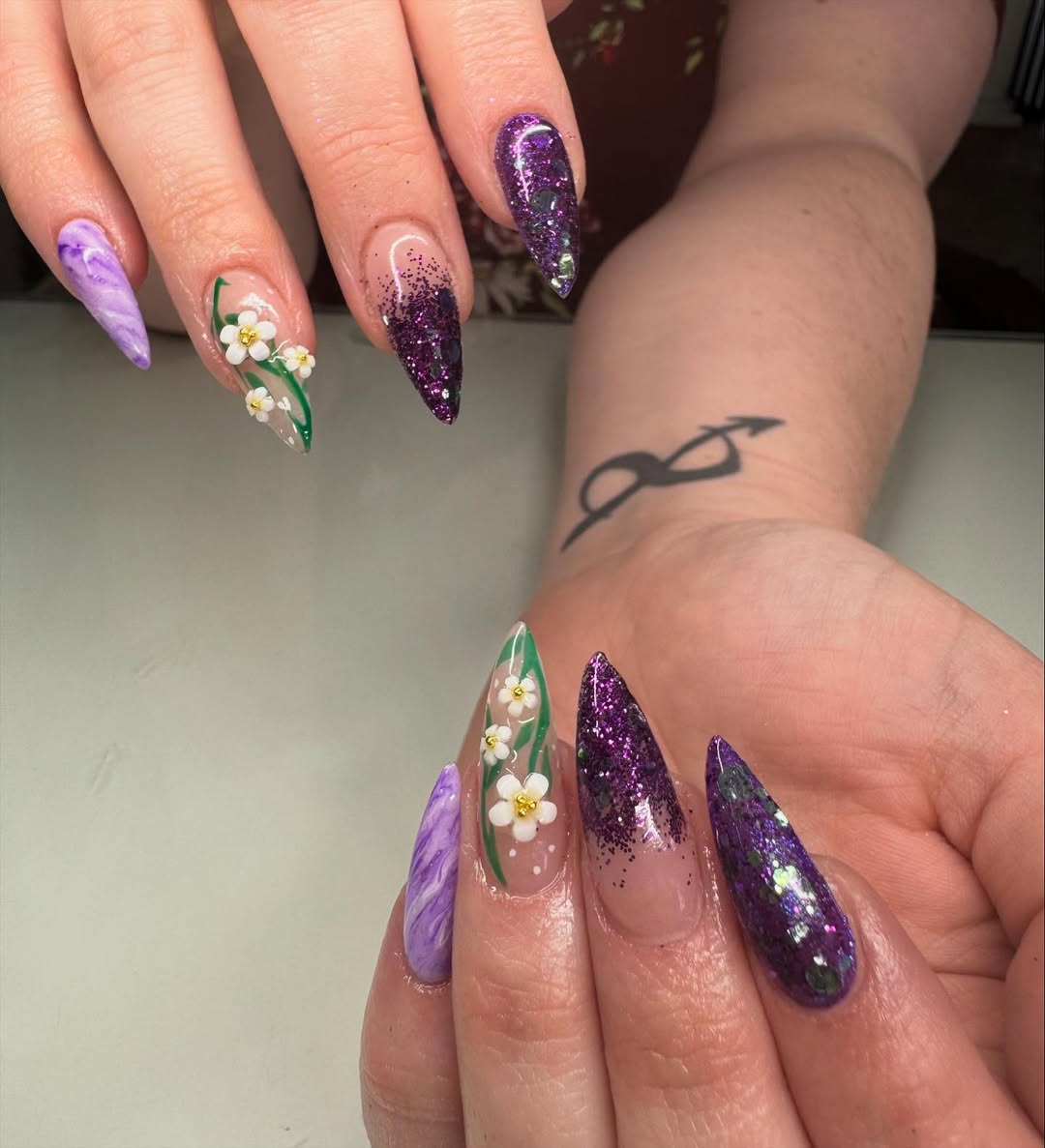 Whimsical Purple Glitter Floral Stiletto Nails