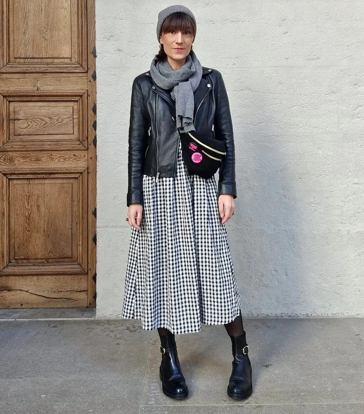 Black Leather Jacket Over Gingham Midi Dress And Boots