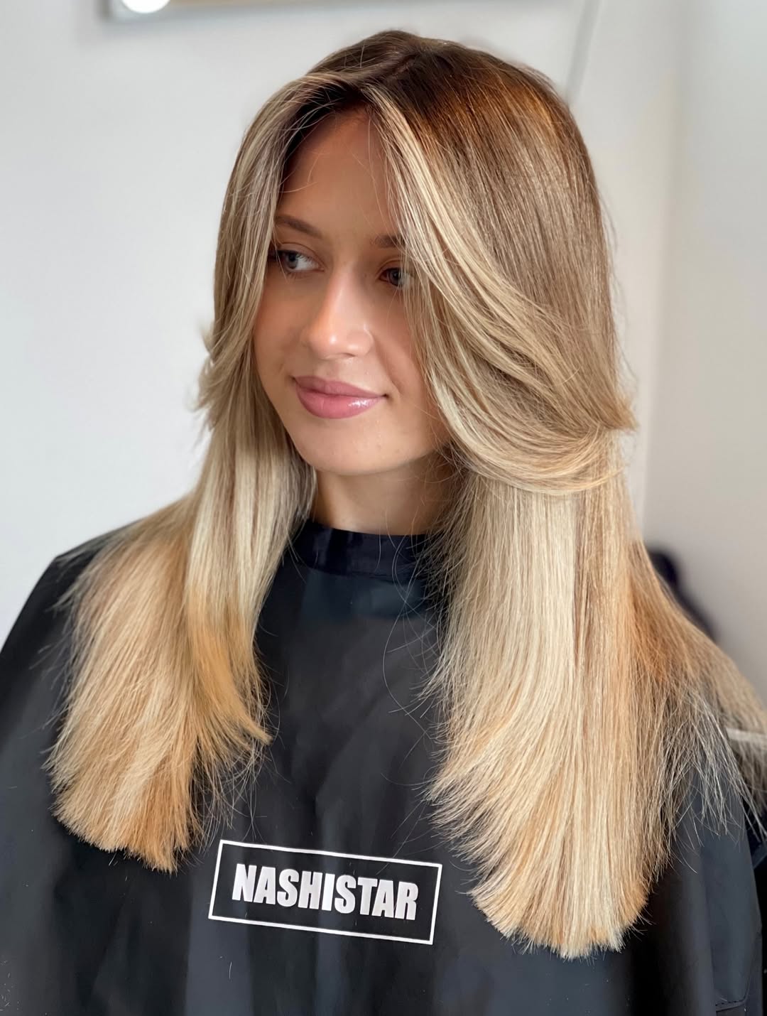Blonde Face-Framing Layers With Shadow Root