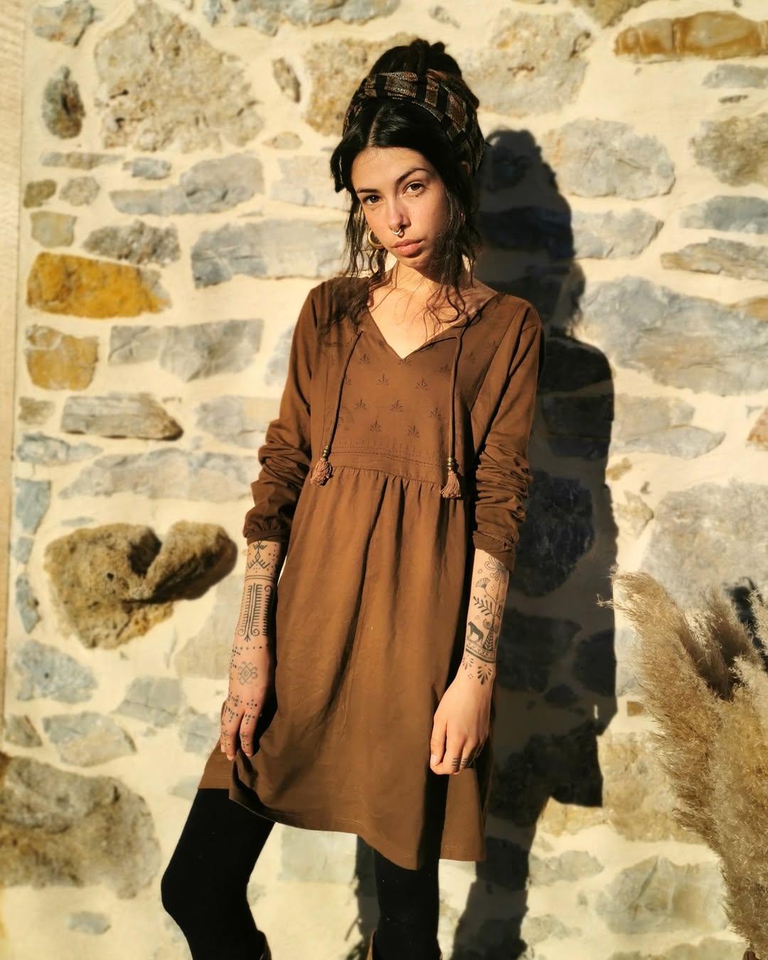 Boho Tunic Dress With Tassels Under Stone Wall