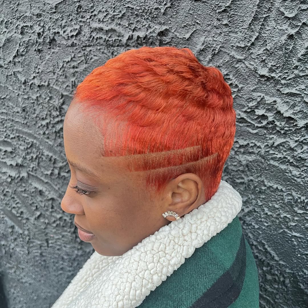 Bold Orange Pixie Cut With Shaved Design