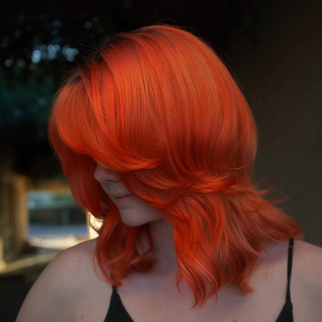 Bold Orange Shag With Face-Framing Layers