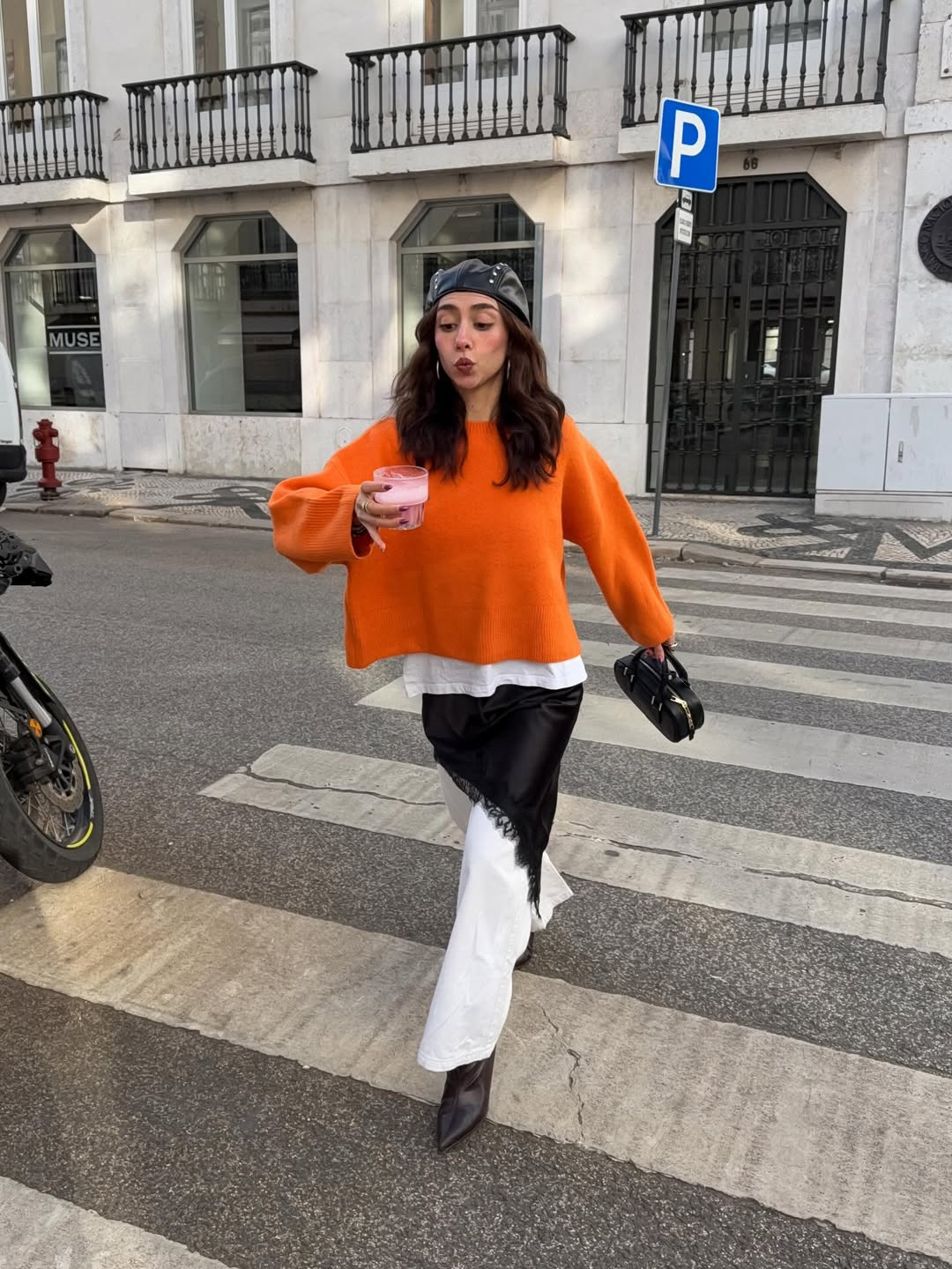 Bold Orange Sweater With Silky Black Skirt