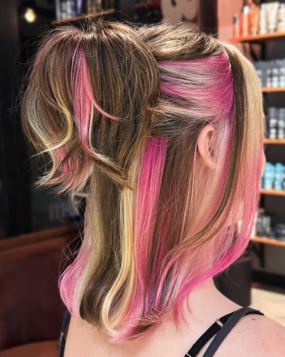 Bold Pink & Blonde Streaks With Messy Bun