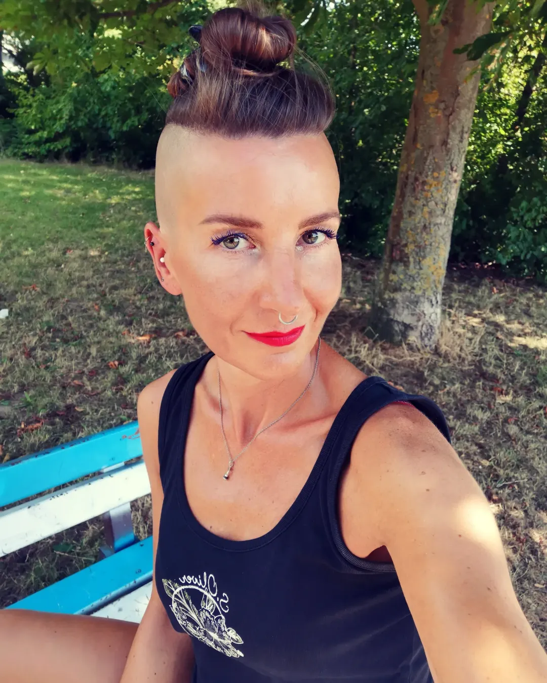 Bold Undercut With A High Top Knot